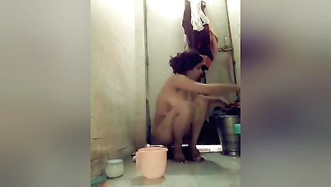 Indian hairy girl stretches her legs in the shower
