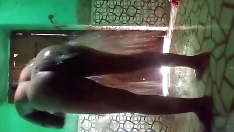 Indian brunette has her perfect body shown in a shower