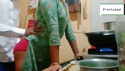 Indian babe in the kitchen gives a blowjob to her husband