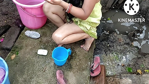 Indian girl in shower tub is bathing with some hot water