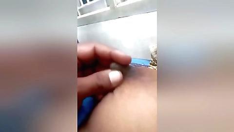 Indian brunette in a sexy outfit is on her back in bed