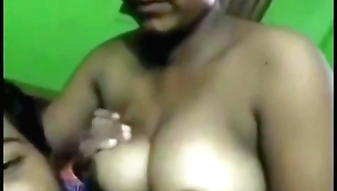 Busty brunette with a large pair of boobs in a handjob