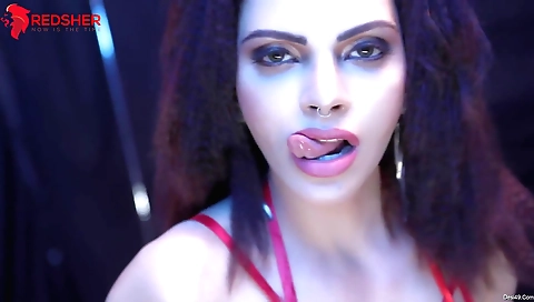 Sexy redhead in a sexy black dress in a solo video