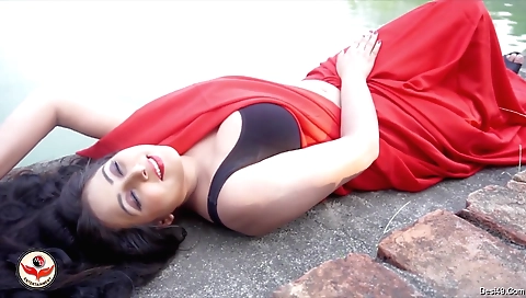 Indian brunette girl in a bikini gets lots of sun outdoors