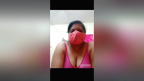 Busty brunette in a pink bikini on the webcam video