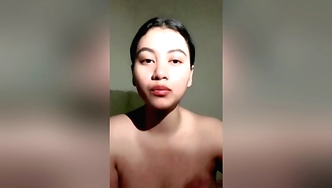 Hot brunette smoking a cigarette and sucking her own prick