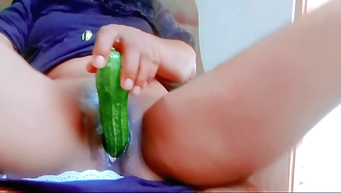 Asian girl in her bedroom masturbates with a dildo