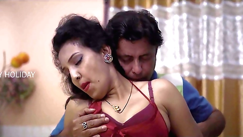 A big round haired brunette babe is playing with her hair