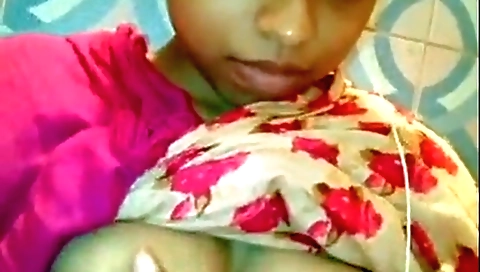 Busty brunette in a bikini shows off her big boobs in this video