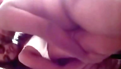 Hot brunette in a dress and stockings is showing off