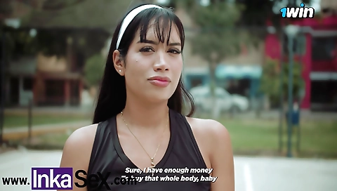 Torn red bra catches a young peruvian ball in volleyball