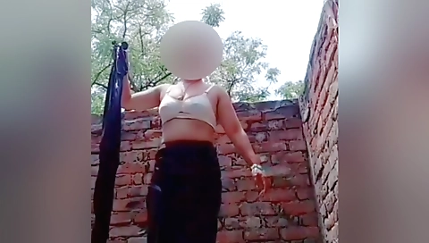 Cherie naked and wearing a white towel in her bathroom