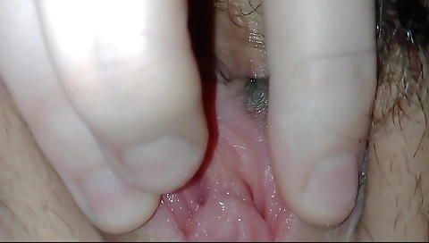 Slutty brunette with a long hairy pussy enjoys her sexy body