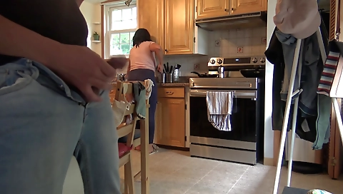Hot amateur brunette shows her sexy body in the kitchen