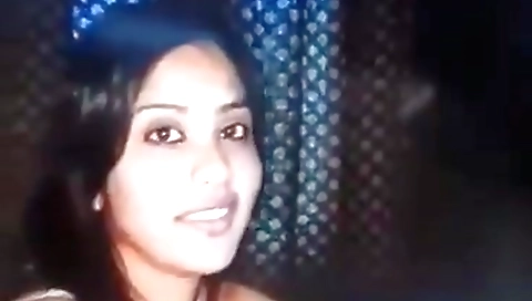 Indian brunette with a shaved pussy is playing with her cock