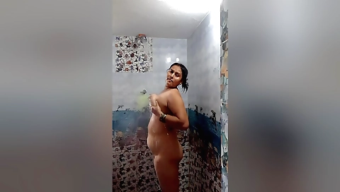 Hot brunette with a big ass taking a shower in amateur video