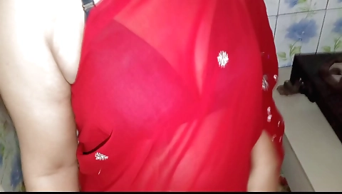 Wife is working in the kitchen and she came from behind